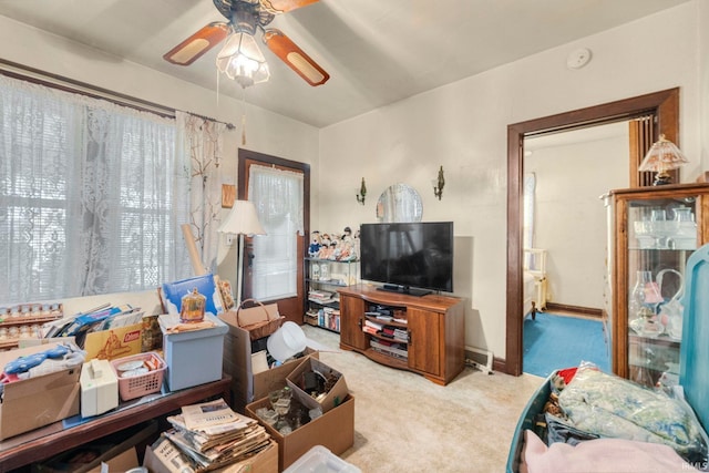 carpeted living room featuring ceiling fan