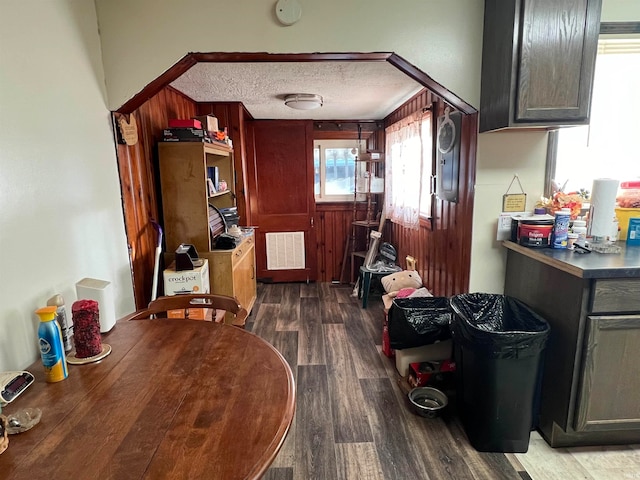 kitchen featuring dark hardwood / wood-style floors and a textured ceiling