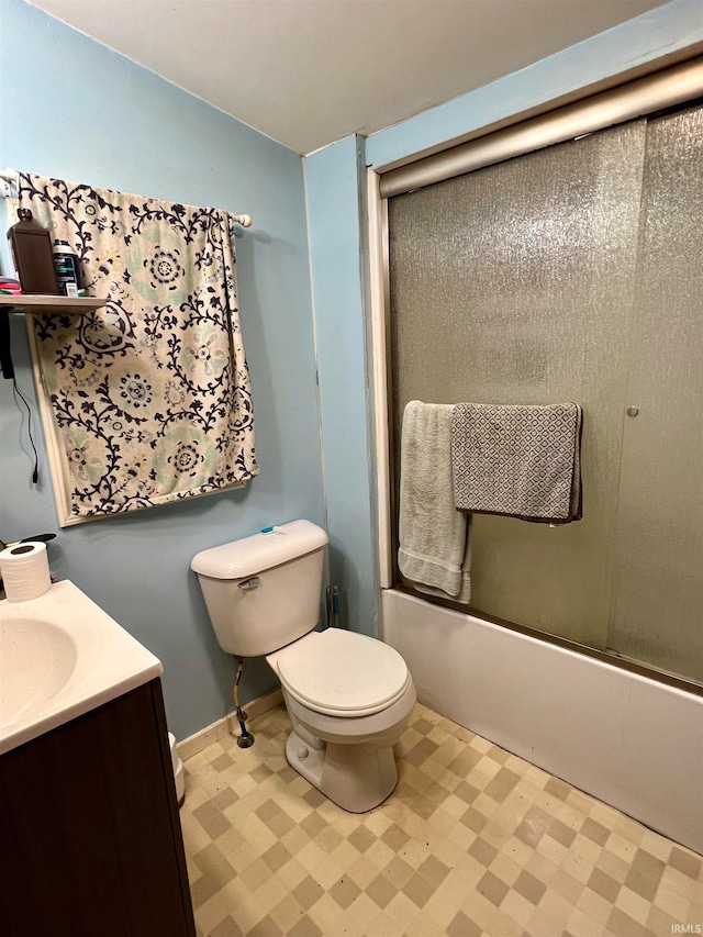 full bathroom with shower / bath combination with glass door, vanity, and toilet