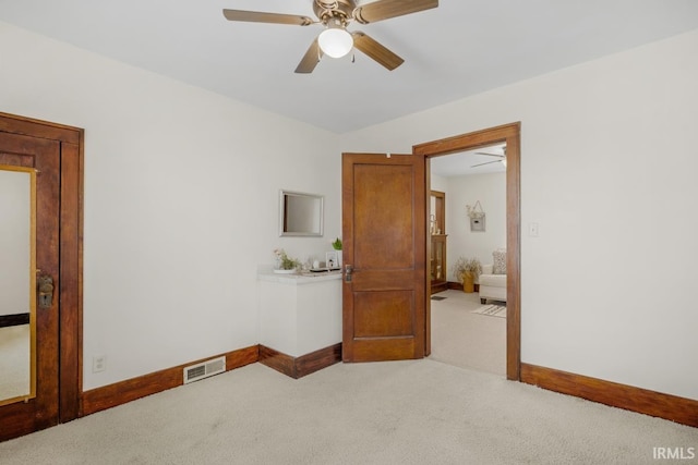 bedroom with light colored carpet and ceiling fan