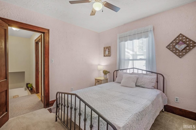 bedroom featuring light carpet and ceiling fan