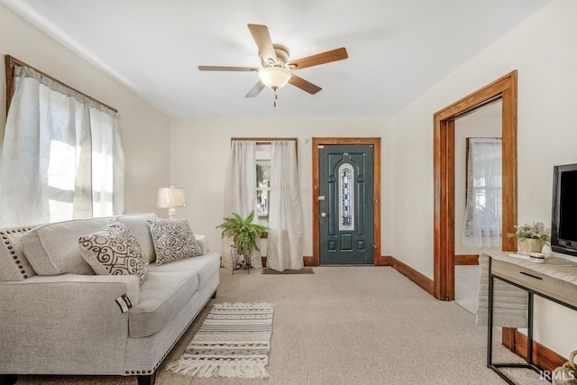 living room featuring light carpet and ceiling fan