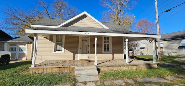 bungalow-style home with a porch and a front yard