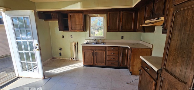 kitchen featuring sink and dark brown cabinets