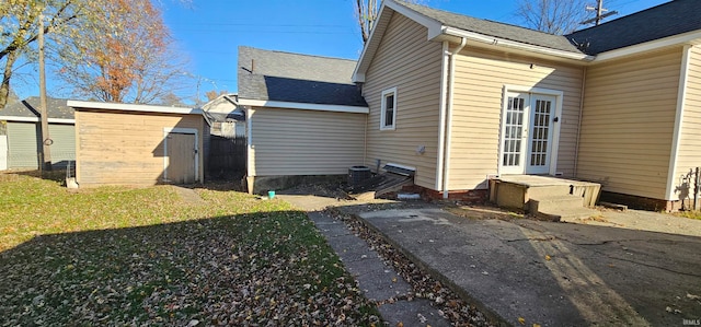 view of property exterior with a shed and a yard