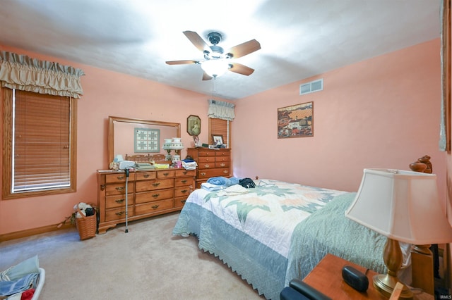 carpeted bedroom with ceiling fan