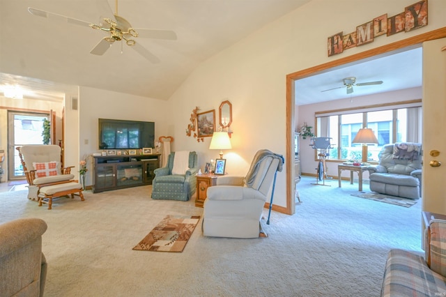 living room featuring ceiling fan, carpet, and lofted ceiling