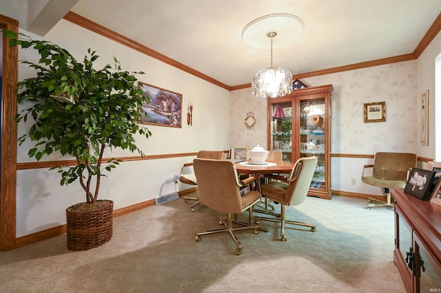 dining space featuring carpet flooring, crown molding, and a chandelier