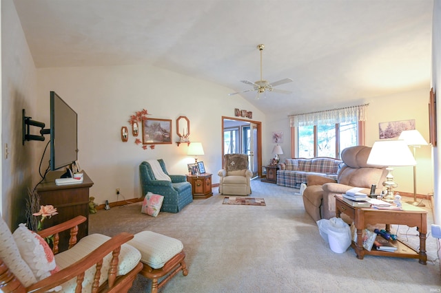 carpeted living room with ceiling fan and lofted ceiling