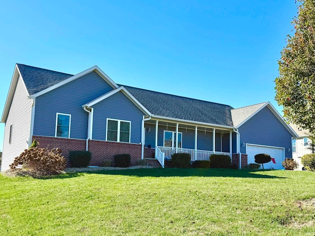 ranch-style house featuring a garage, a porch, and a front yard