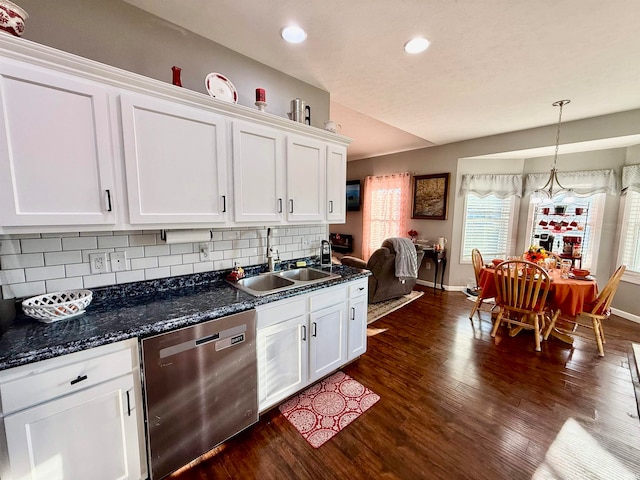 kitchen featuring dishwasher, decorative backsplash, white cabinets, sink, and dark hardwood / wood-style floors