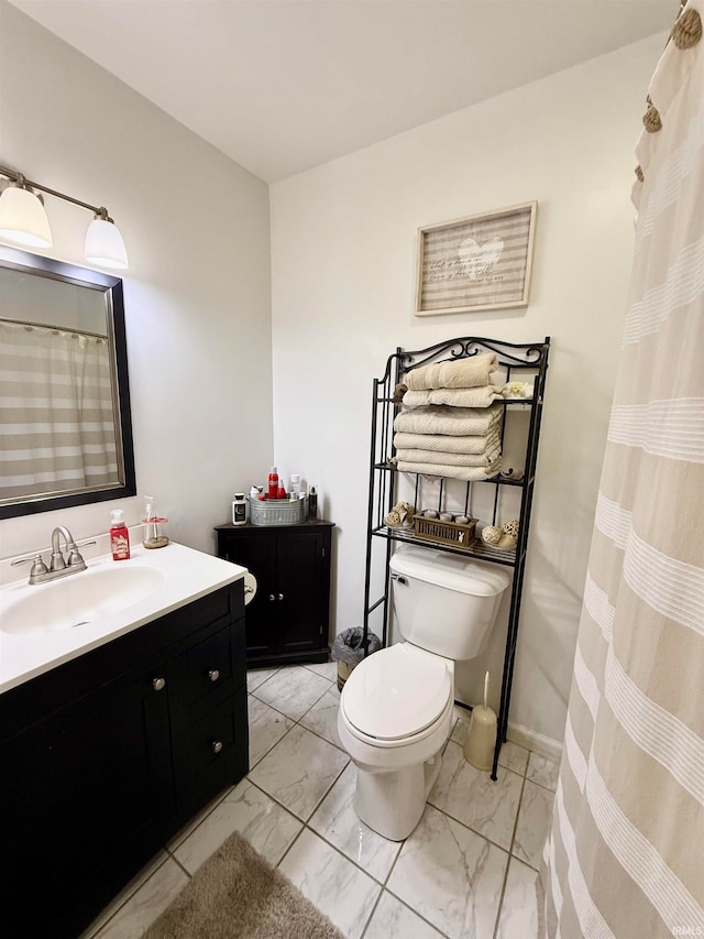 bathroom featuring vanity and toilet