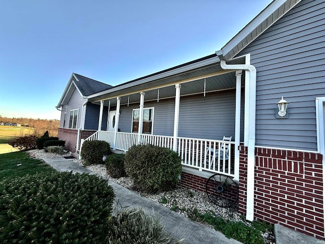 view of home's exterior with covered porch