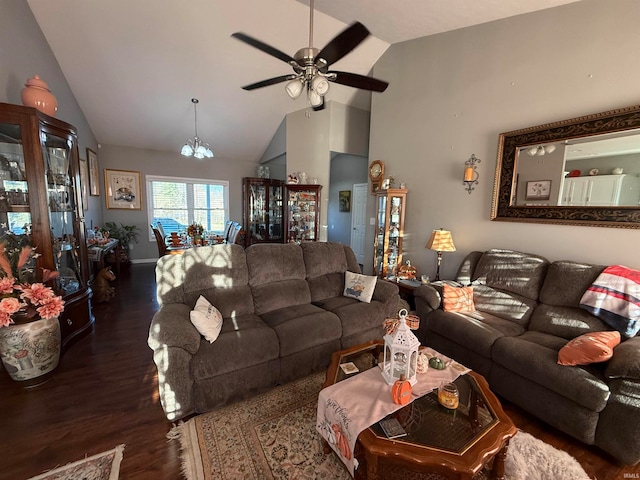 living room with dark hardwood / wood-style flooring, lofted ceiling, and ceiling fan with notable chandelier