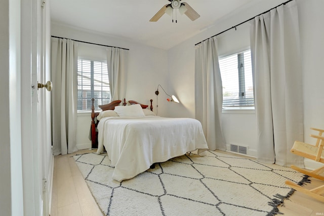 bedroom featuring ceiling fan and light hardwood / wood-style flooring