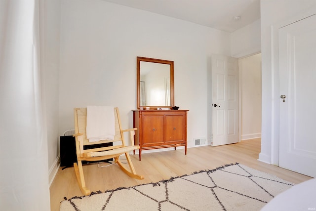 sitting room featuring light wood-type flooring