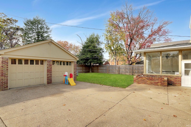 garage featuring a lawn