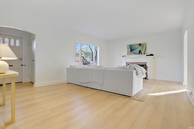 living room with light hardwood / wood-style flooring