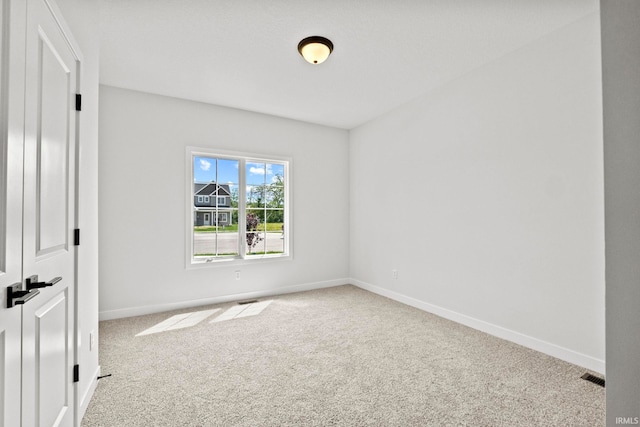 spare room featuring carpet flooring