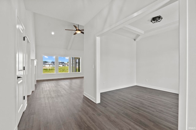 interior space with lofted ceiling with beams, dark hardwood / wood-style flooring, and ceiling fan