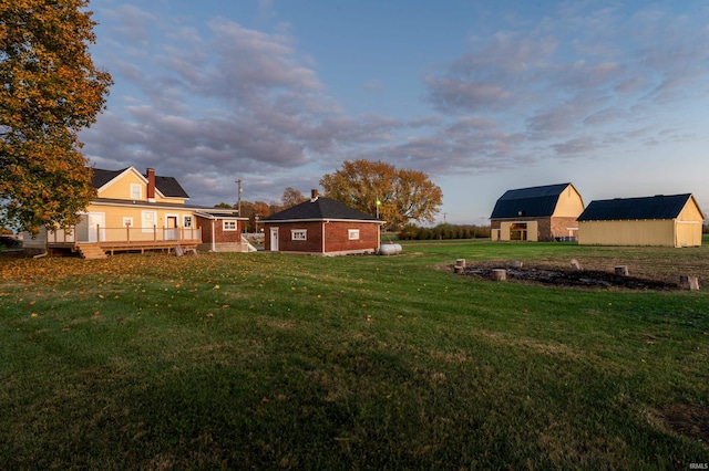 view of yard featuring an outbuilding and a deck