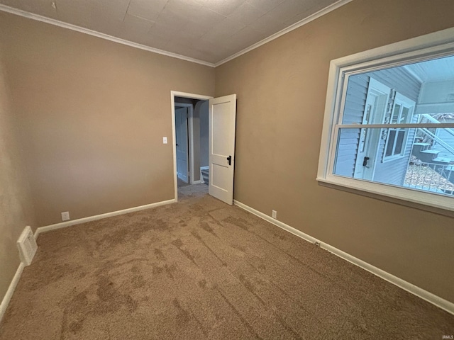 unfurnished bedroom with carpet and ornamental molding