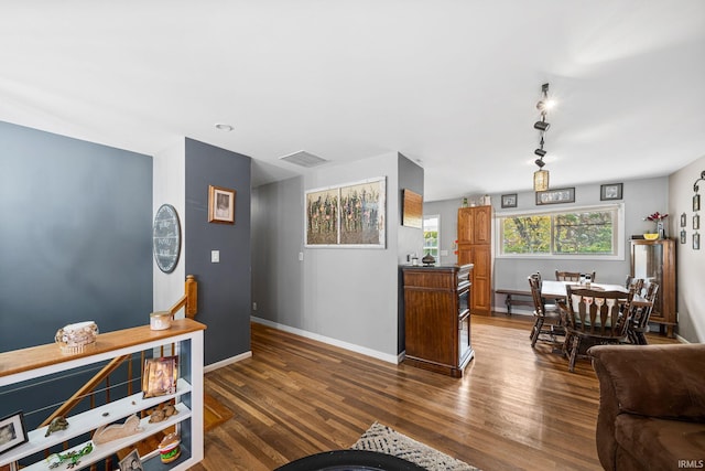 living room featuring dark wood-type flooring