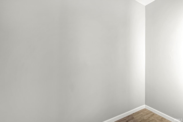 spare room featuring hardwood / wood-style flooring