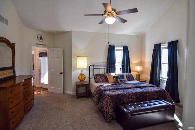 bedroom featuring vaulted ceiling, ceiling fan, and carpet floors