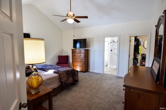 carpeted bedroom with ceiling fan, ensuite bath, and lofted ceiling