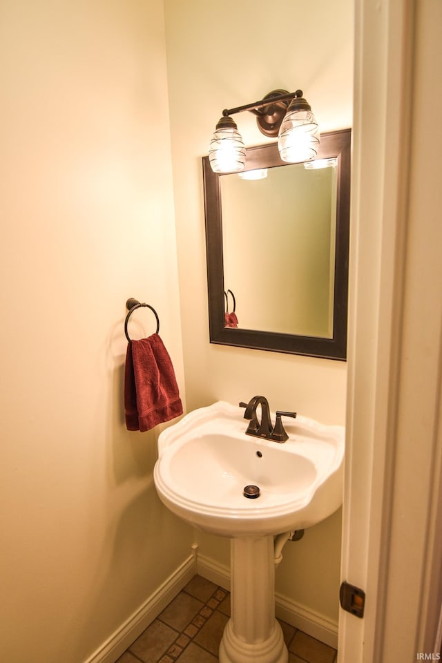 bathroom with tile patterned floors