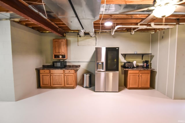 basement with stainless steel fridge