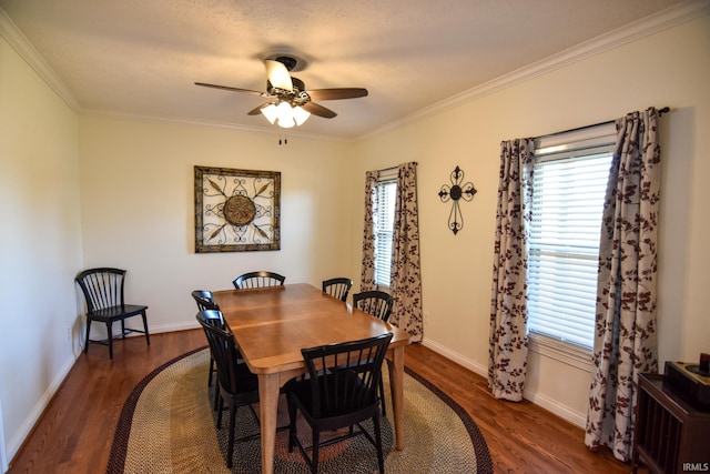 dining room with ornamental molding, dark hardwood / wood-style flooring, and ceiling fan