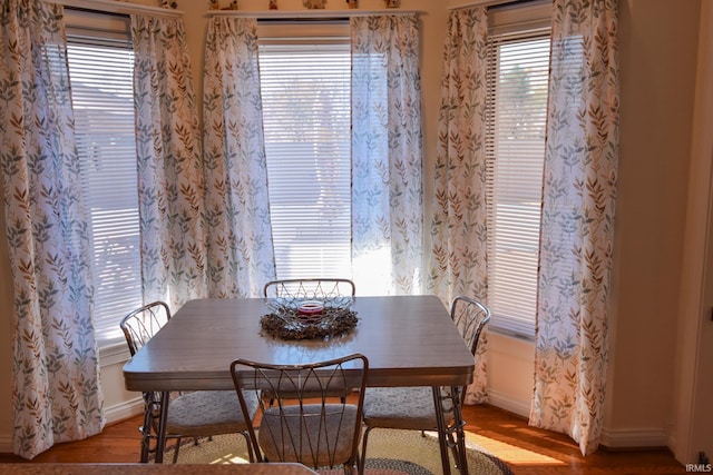 dining space with light wood-type flooring