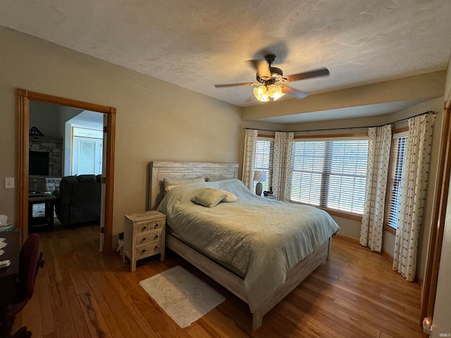 bedroom featuring wood-type flooring and ceiling fan