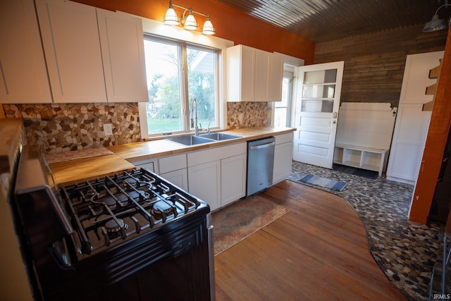 kitchen featuring dishwasher, sink, white cabinets, and black gas range oven