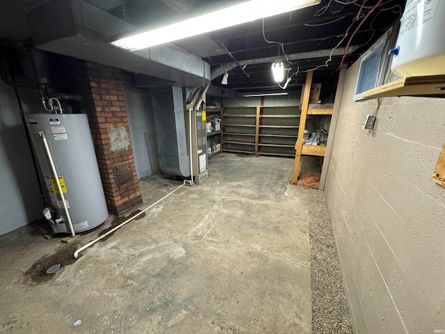 basement featuring heating unit and gas water heater