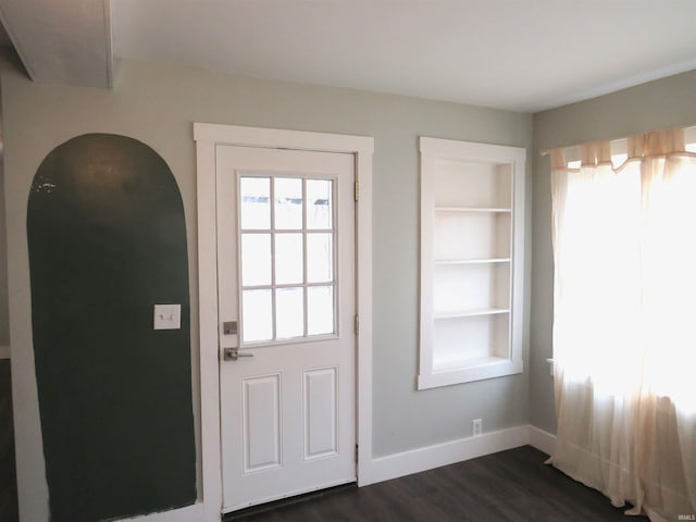 doorway to outside featuring dark hardwood / wood-style flooring