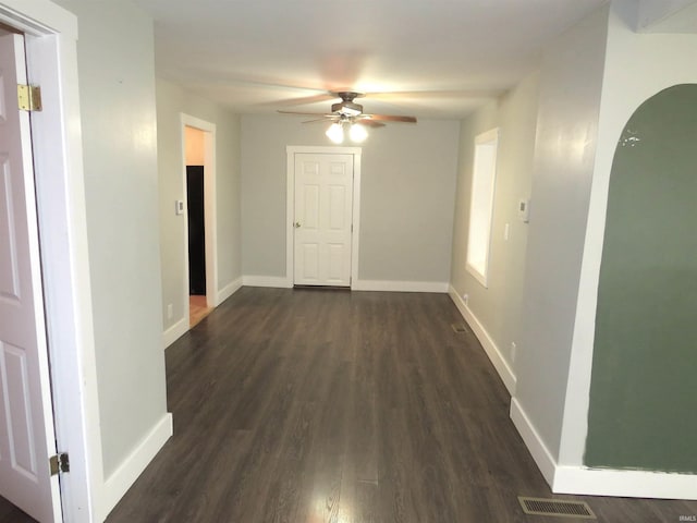 hallway featuring dark wood-type flooring