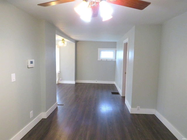 empty room featuring dark wood-type flooring