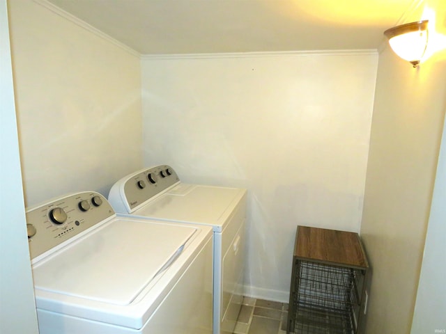 washroom with tile patterned floors, separate washer and dryer, and ornamental molding