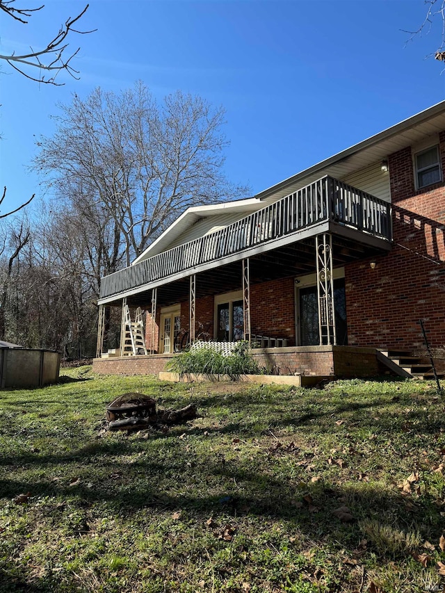 rear view of property with french doors