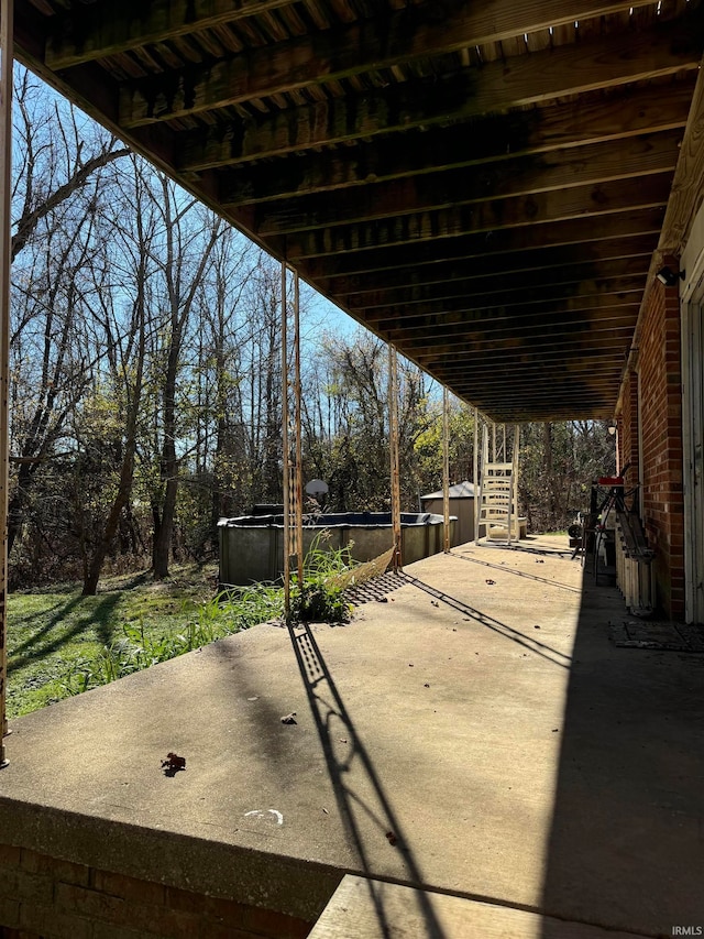 view of patio with a pool