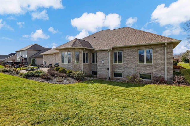 back of house with a yard and a patio area