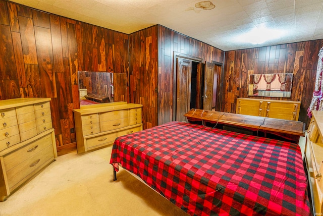 carpeted bedroom with wooden walls