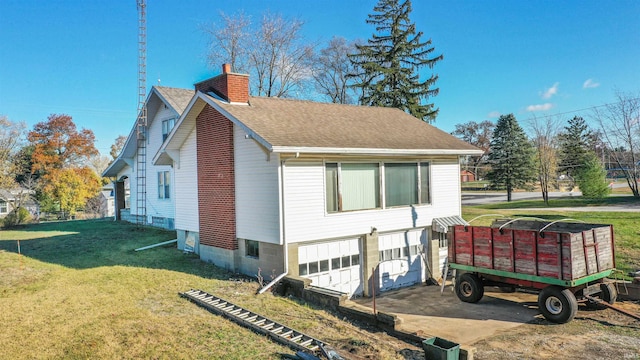 view of property exterior with a garage and a yard