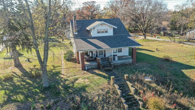 view of front of house featuring a porch and a front lawn