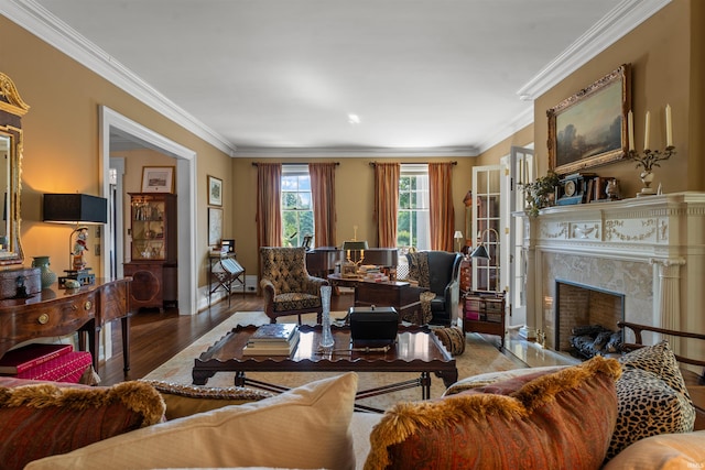 living room featuring wood-type flooring and crown molding