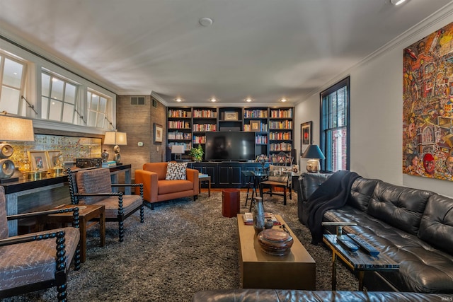 carpeted living room with crown molding