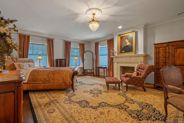 bedroom featuring ornamental molding and hardwood / wood-style floors